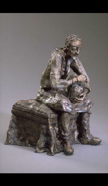 A statue of a man sitting on top of a bench.